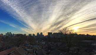 Drifting clouds colored by sunrise in Beijing